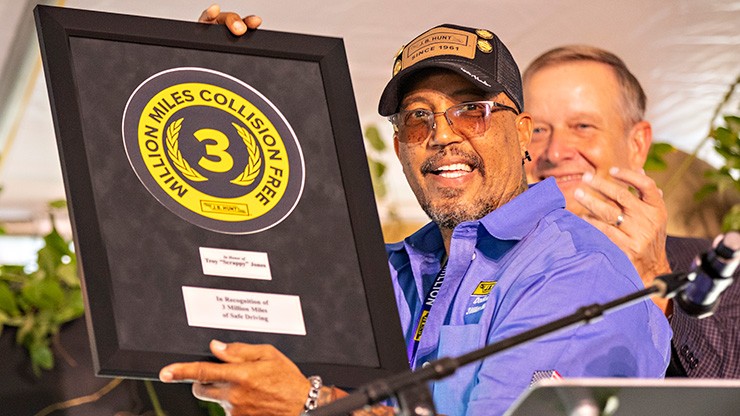 million mile driver holding an award