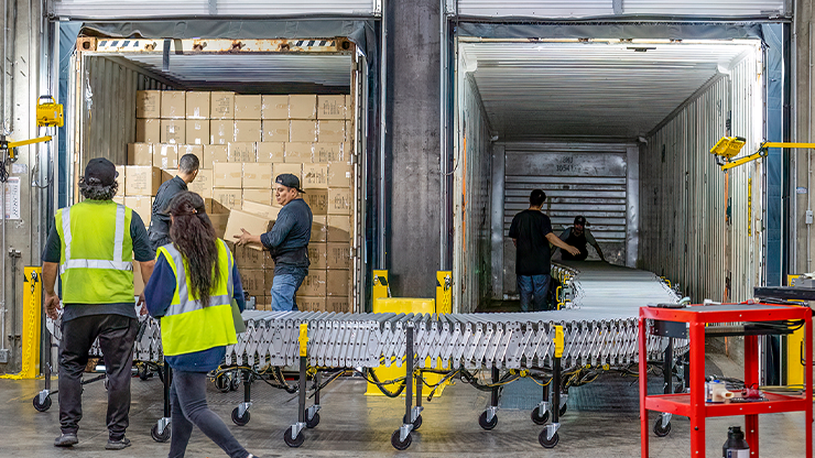 photo of workers unloading a truck